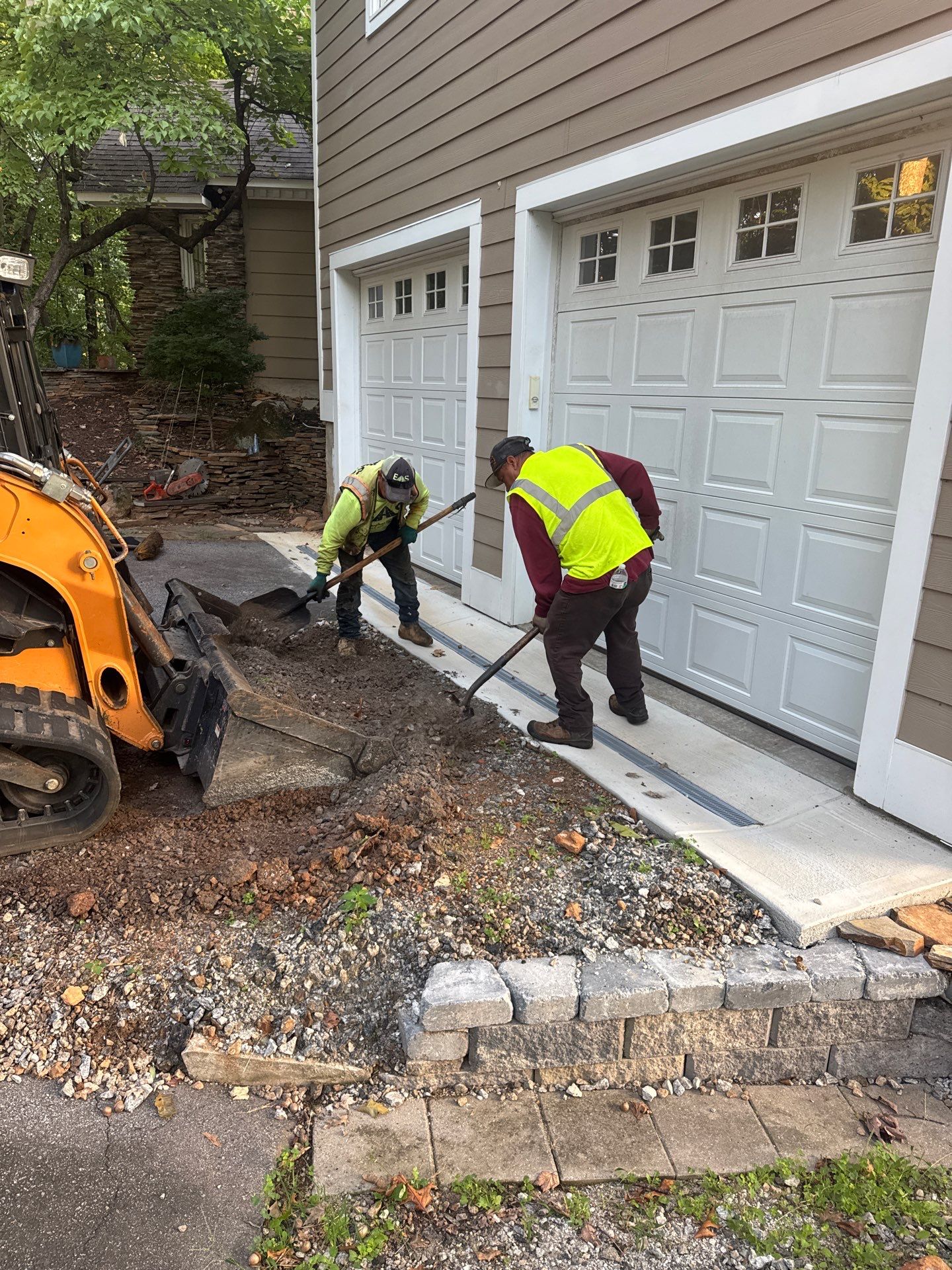 Asphalt driveway work at a residential property